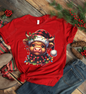 Red t-shirt with a festive cow design with Christmas decorations.